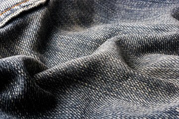 clothing items blue stonewashed faded jeans cotton fabric texture with seams, clasps, buttons and...