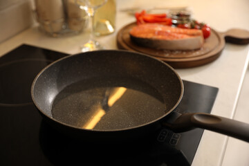 Frying pan with cooking oil on cooktop