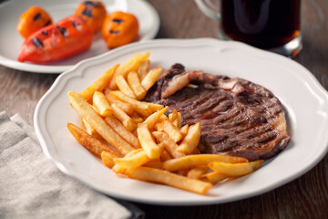 Beef steak with French fries. High quality photo.