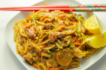 Cooked free range egg noodles with shredded duck in a savoury plum, ginger, chilli and garlic sauce with onions, carrots, pak choi, water chestnuts