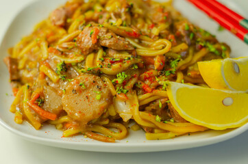 Cooked free range egg noodles with shredded duck in a savoury plum, ginger, chilli and garlic sauce with onions, carrots, pak choi, water chestnuts