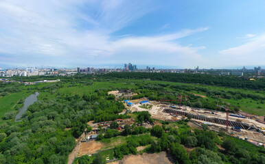 Fototapeta na wymiar Panoramic view of Moscow on a sunny day, Russia. Picturesque region in the north-west of Moscow city. Terekhovo metro station site