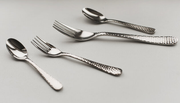 silver stainless cutlery on a light background
