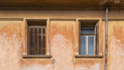 Fototapeta na wymiar Old fashioned wooden windows, on grunge wall background.