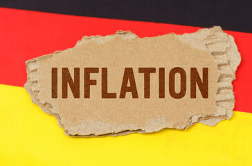 Against the background of the German flag lies cardboard with the inscription - inflation
