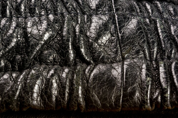 Old vintage genuine soft black leather texture background, top layer with pores and scratches, macro, close-up