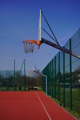 A basketball hoop in a park on a sunny  day - selective focus © skorpionik00