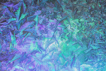 Natural ice texture on the frozen window in colorful light. Gradient color. Christmas background