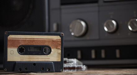 old tape recorder and cassette on  wooden table