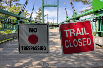 Sign no trespassing trail closed at the park entrance. Closure of outdoor facilities, national...
