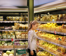 Woman buying fruits at the market