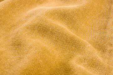 clothing items stonewashed cotton fabric texture with seams, clasps, buttons and rivets, macro