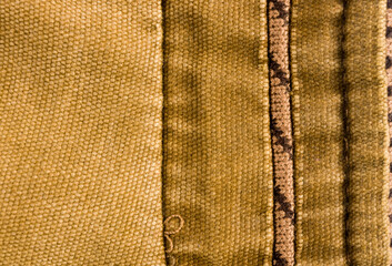 clothing items stonewashed cotton fabric texture with seams, clasps, buttons and rivets, macro