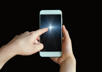 The woman's index finger points to the blue screen of a smartphone, a mobile phone on a black background. Point your finger at the phone screen in close-up. Virtual Reality. Online communication