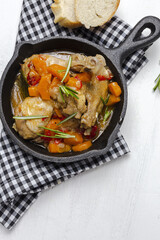 Homemade beer chicken stew with vegetables and aromatic herbs