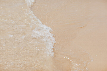 Fototapeta na wymiar Sea coast top view. Sand and wave. Nobody. Summertime.