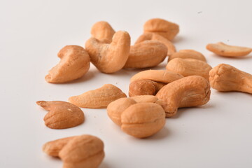 Heap of cashew nuts isolated on white background.