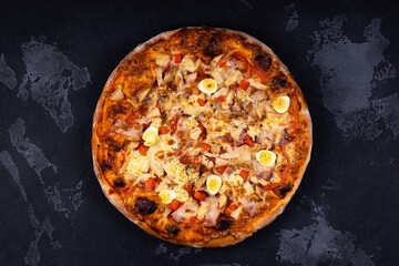 Top view of delicious and crispy pizza. American or Italian pizza. Cooking background concept.