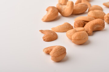 Heap of cashew nuts isolated on white background.