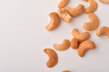 Heap of cashew nuts isolated on white background.