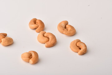 Heap of cashew nuts isolated on white background.