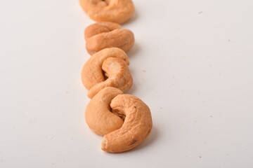 Heap of cashew nuts isolated on white background.