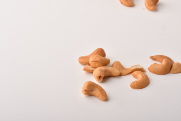 Heap of cashew nuts isolated on white background.