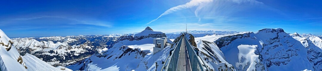 Peak walk on the Suspension bridge between two mountain peaks (Travel destination Glacier 3000) or...
