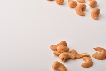 Heap of cashew nuts isolated on white background.