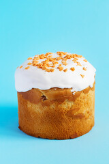 Easter Cake - Russian and Ukrainian Traditional Kulich on a bright blue background. Paska Easter Bread. Happy easter. Kulich cake symbol of Traditional Orthodox Easter
