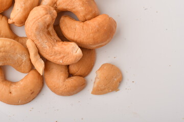 Heap of cashew nuts isolated on white background.