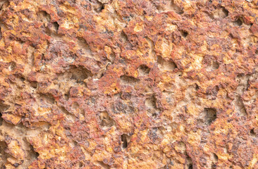 blur of red laterite brick wall Porous and fine-grained Background pattern
