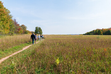 Family walking on a outdoor nature trail in Leland, Michigan