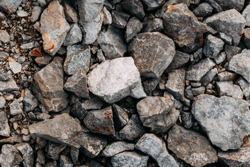 Mining process. Rocks for mining. Big gray limestone.