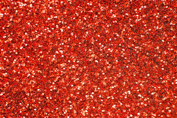 glittering background of red sequins closeup. Sparkle festive texture - obrazy, fototapety, plakaty