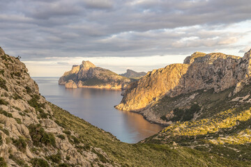 Fototapeta na wymiar Views over the Formentor peninsula with the watchtower Torre de Albercutx and the famous rock Es Colomer