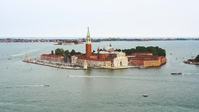 Venice - Church of San Giorgio Maggiore with motor boats and water taxis in the Venice lagoon, seen from above