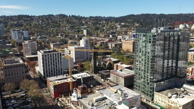 Cinematic Aerial Drone Footage Of Construction And Cranes Near Nob Hill, Goose Hollow, Arlington Heights, Downtown Portland With Skyscrapers And Cityscape In Oregon