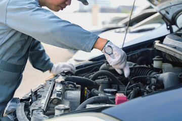 Fototapeta na wymiar Auto mechanic working in garage. mechanic hand hold wrench. Repair service.