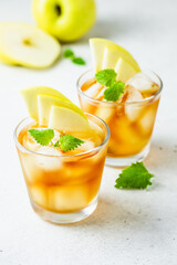 Kombucha cocktail, summer festive party drink, apple iced tea in glasses. Space for text.
