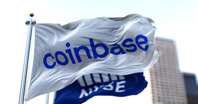 Flags of Coinbase and NYSE flying in the wind