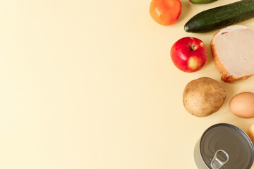 Various grocery, food on the light yellow background, copy space.