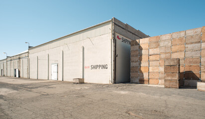 concrete cold room warehouse storage shipping location with red arrow and wood fruit bins yakima washington 