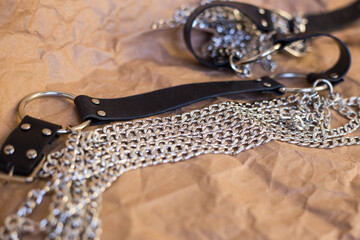 Macro shot of leather goods with metal chains