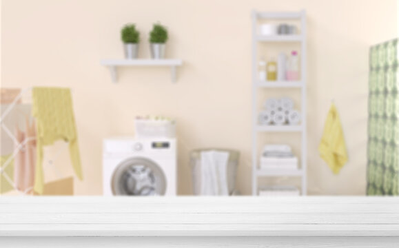 Empty Wooden Table In Laundry Blue Room. Mockup For Your Design.