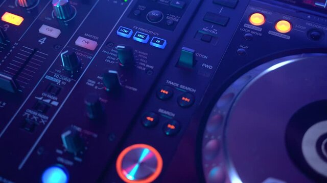 Dj Professional Mixing Controller, stroboscopic light, close up shot