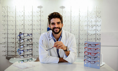 Optician at eyeglasses shop. Medical, health care concept