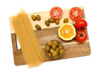 pasta and vegetables on a blackboard