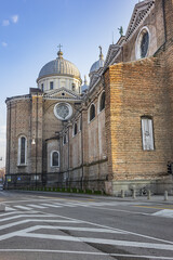 Obraz premium Architectural fragments of Padua Abbey of St. Justina (Abbazia di Santa Giustina - X century Benedictine abbey complex) in front of Prato della Valle square. Padua, Veneto, Italy, Europe.
