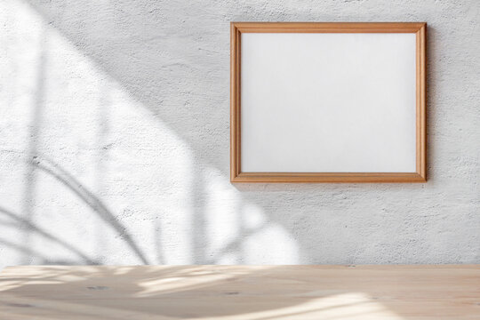Horizontal white frame mockup hanging white gray concrete wall background. Scandinavian interior. Selective focus.